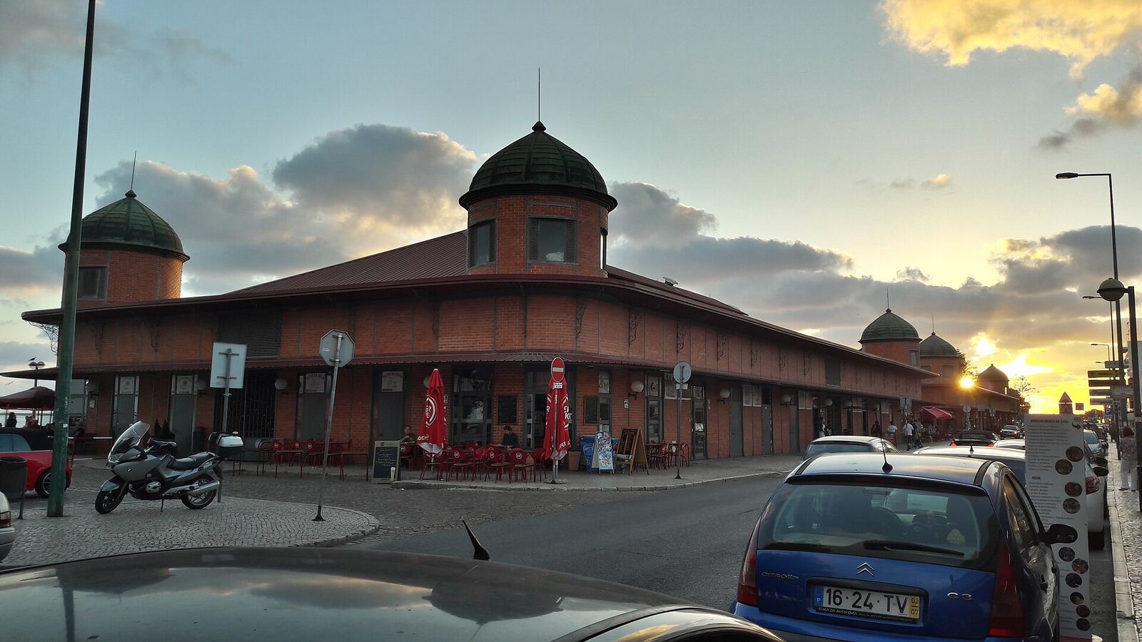 Olhão Municipal Market, a red-brick building with domes, at sunset